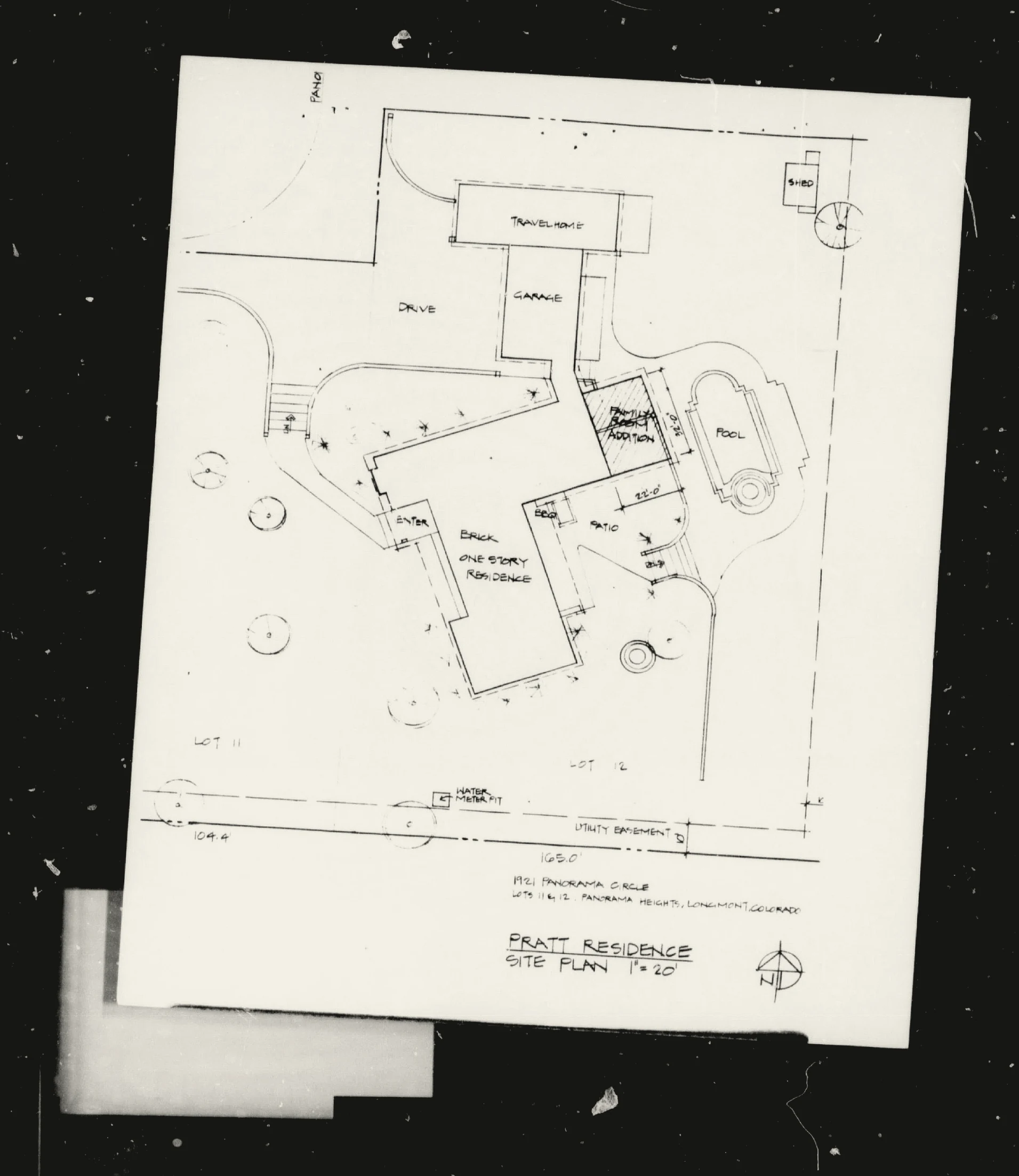 The residence, garage, travel-home bay, patio, pool and spa before later enclosures.