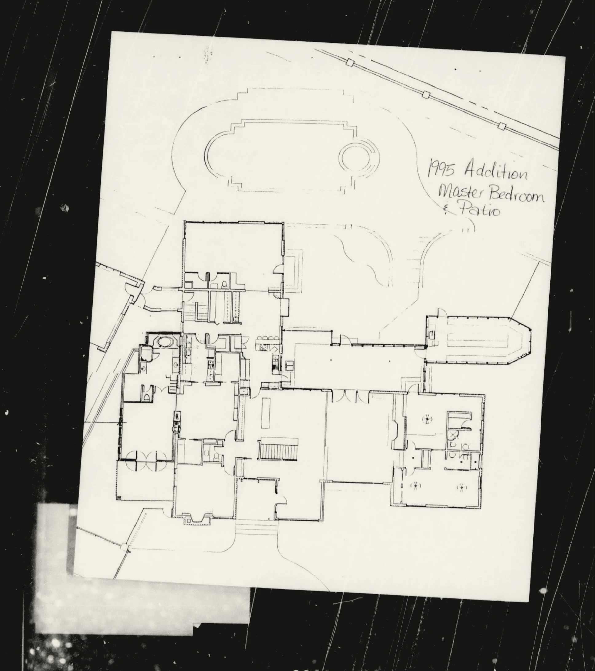 Whole-house plan marked for the primary-bedroom and covered-patio addition.