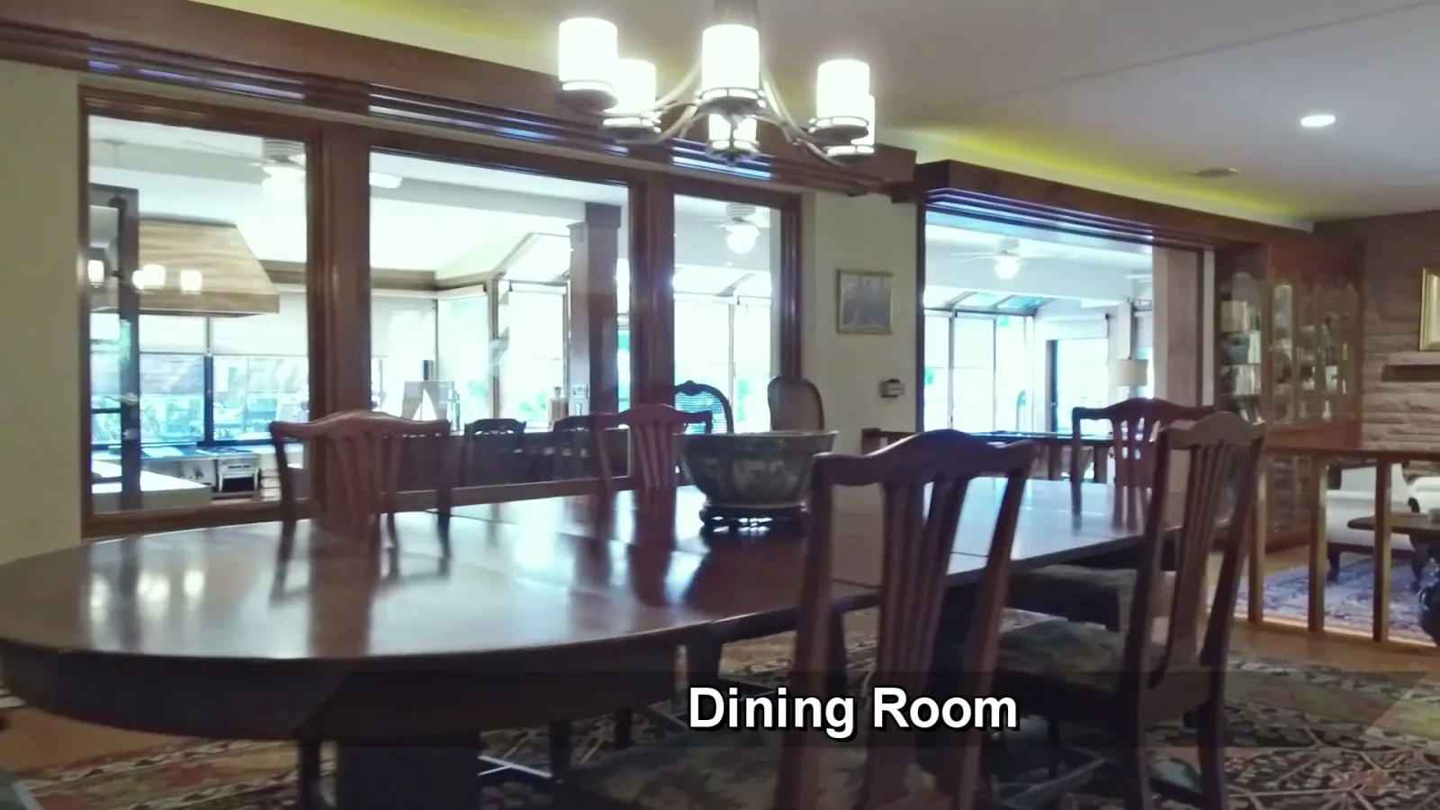 Dining room glazing toward the pool pavilion and gardens.