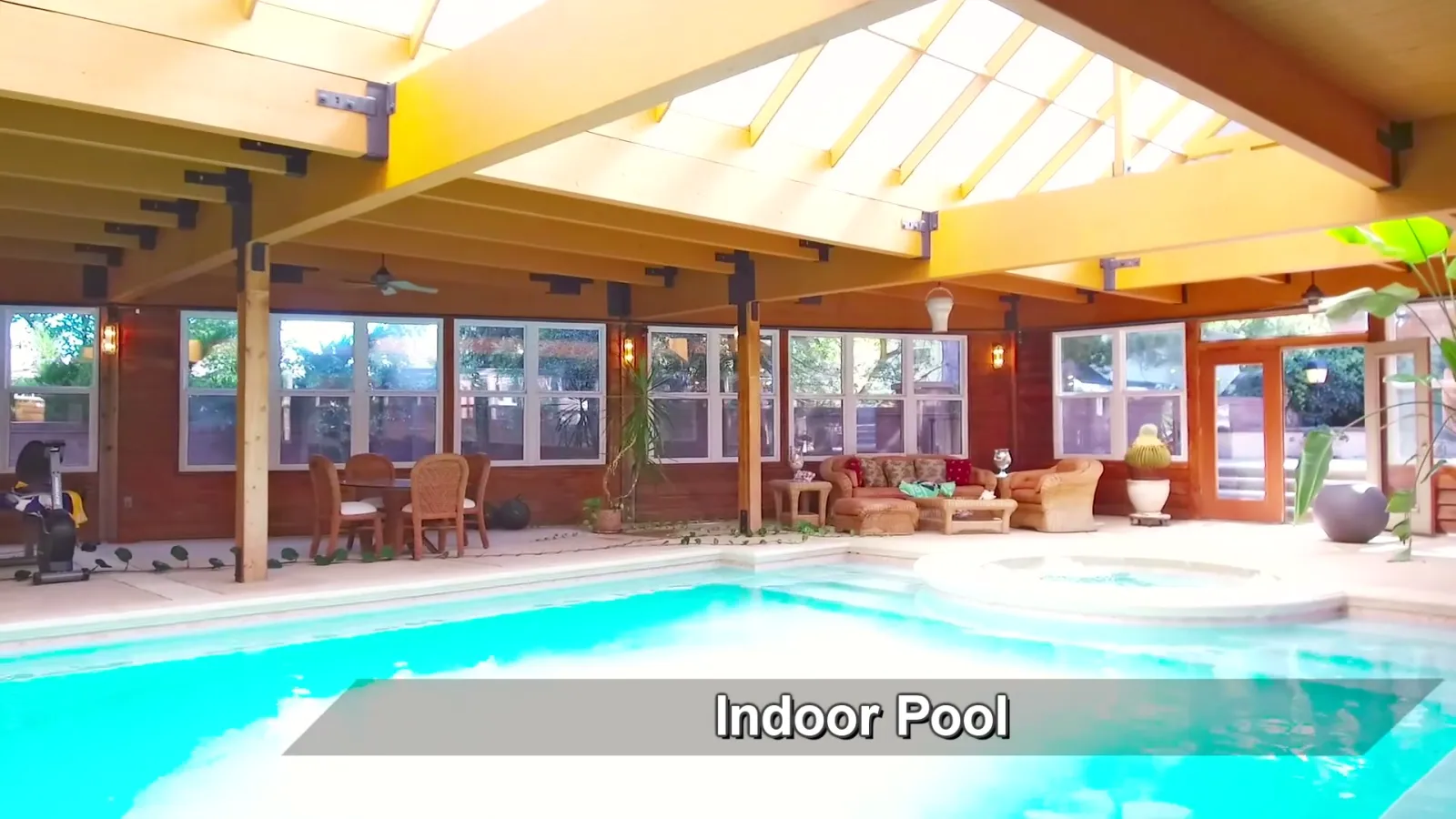 The indoor pool beneath broad roof lights.