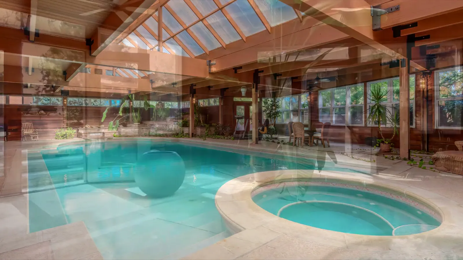 Pool and spa together inside the long pavilion.