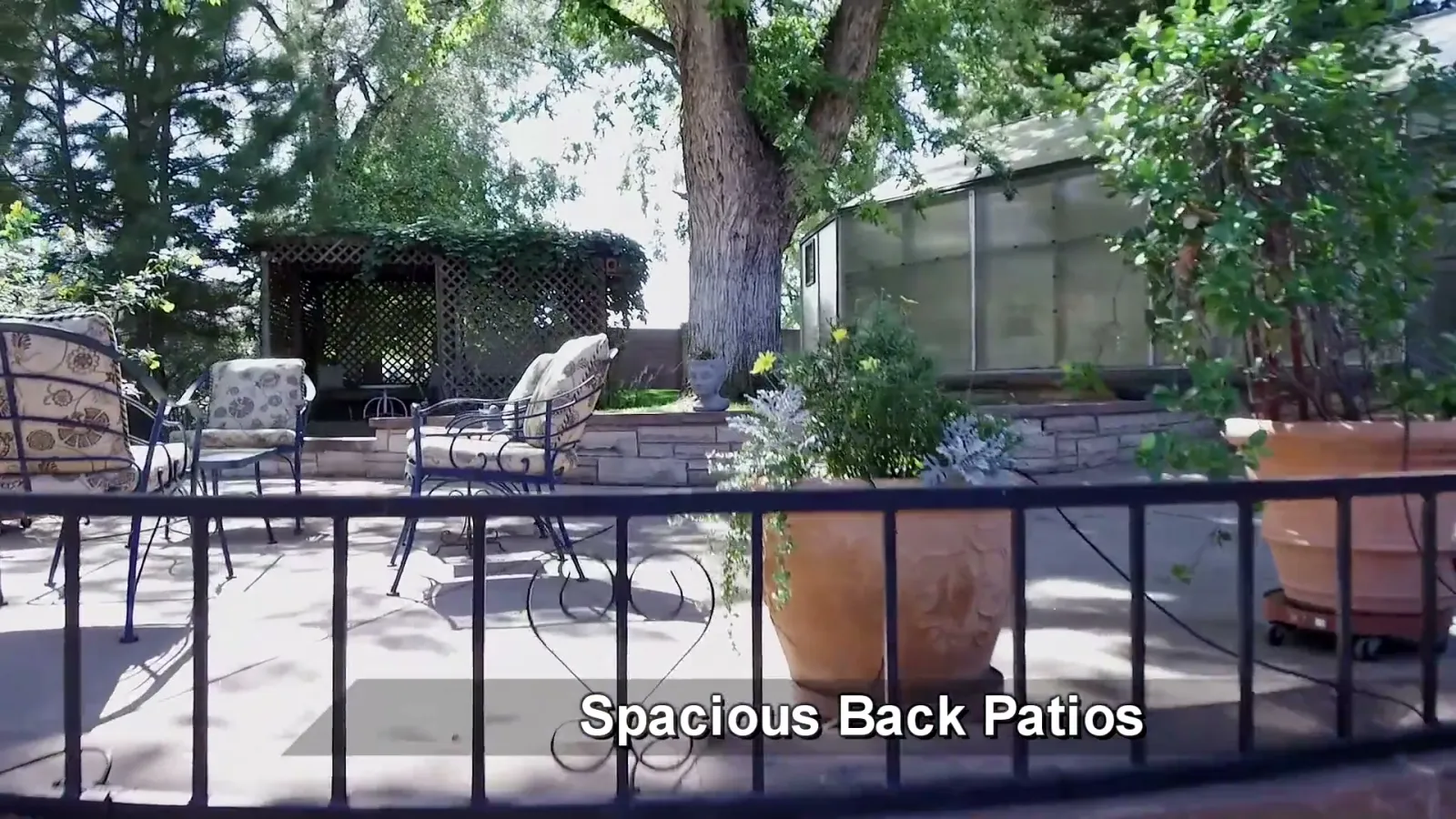 The rear patio network along the garden side of the house.