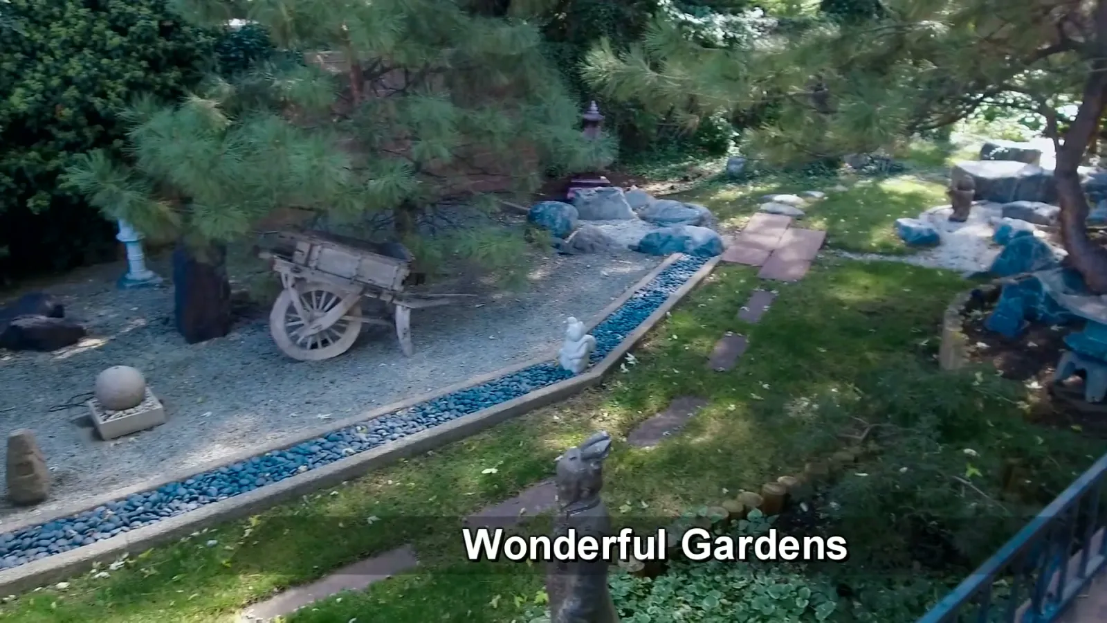 The Japanese garden: stone, water, mature planting, and controlled views.