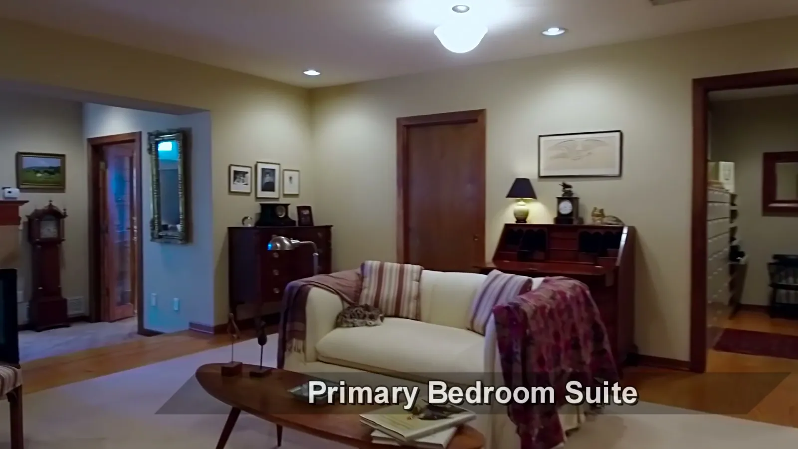 The primary-bedroom suite and its internal sitting area.
