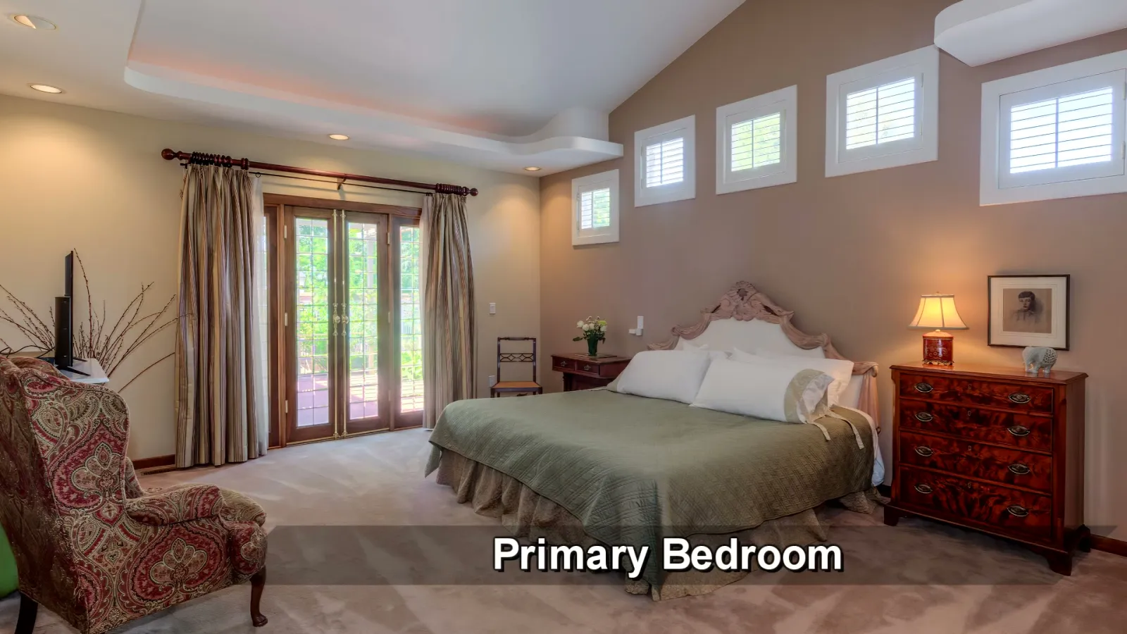 The primary bedroom opening toward the garden.