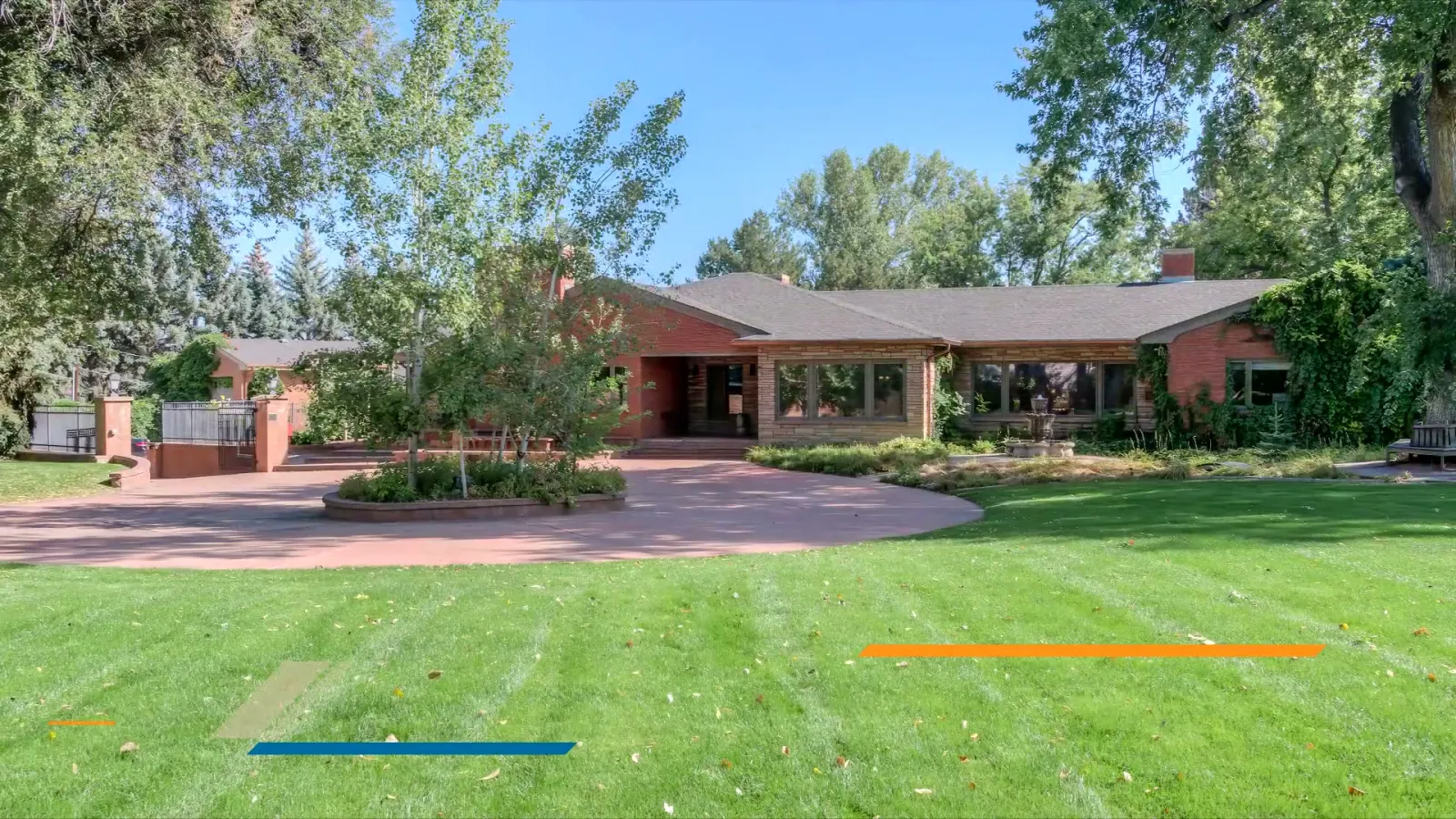 The golf-course-facing elevation across the lawn.