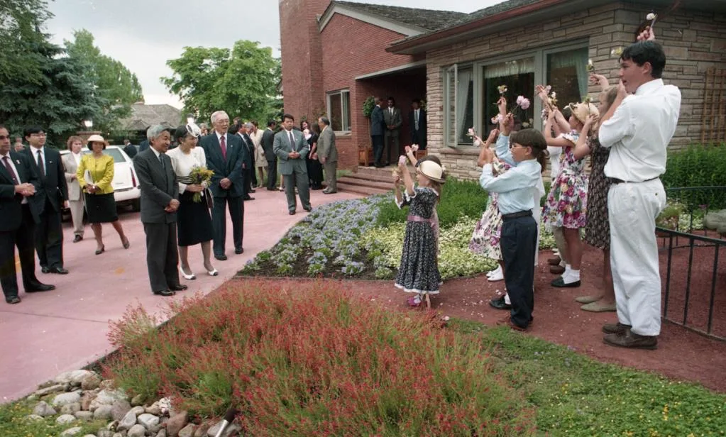 Children, neighbors and officials outside the Pratt residence during the June 18 welcome