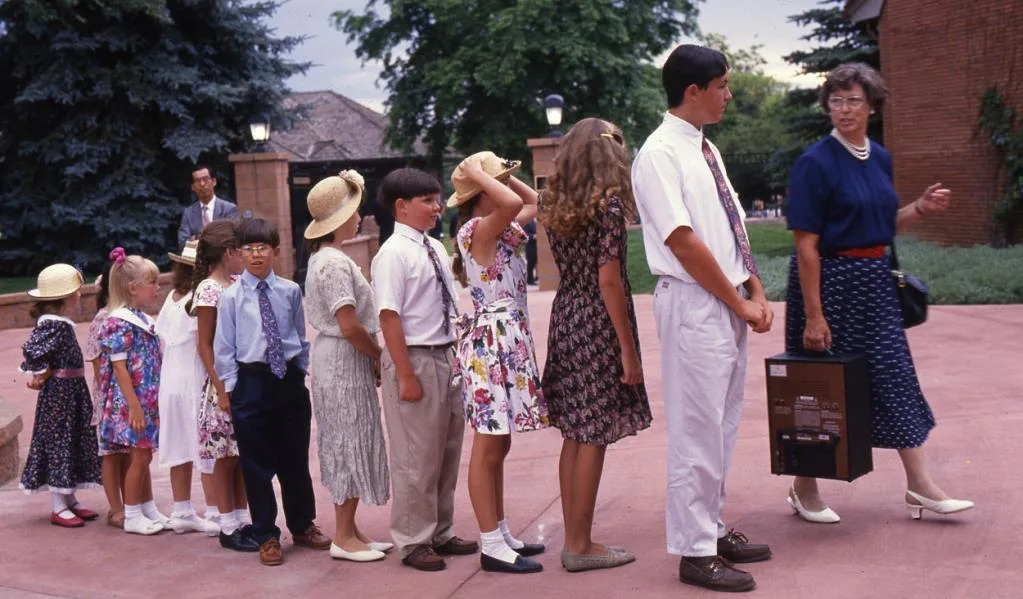 Children waiting with flowers for the imperial couple