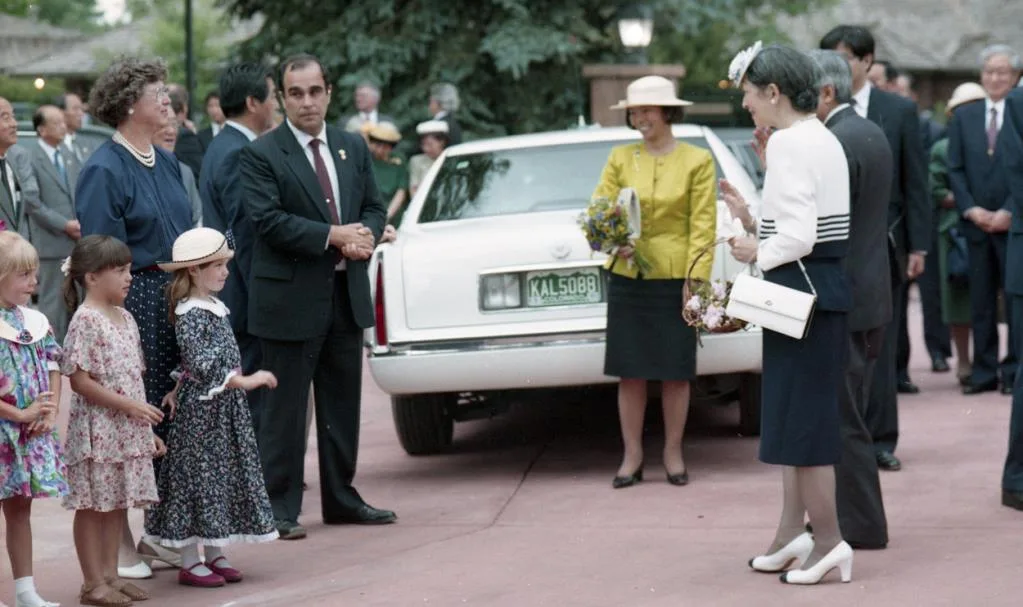 Empress Michiko greeting members of the Longmont welcome party