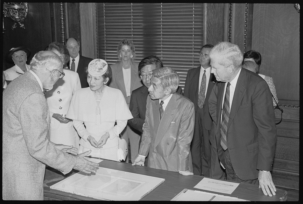 The imperial couple viewing Library of Congress collection materials